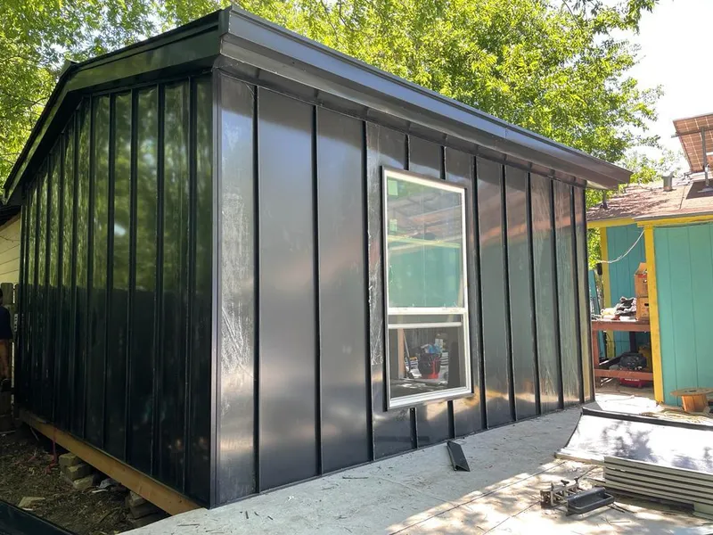 Black standing seam metal wall panels for Roof Inspection in Peabody