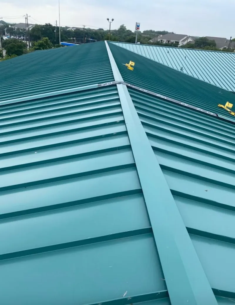 Green commercial metal roof ridge and valley for Metal Roof Repair in Peabody